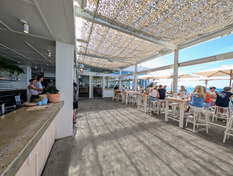 Burleigh Pavillion on the beach at Burleigh Heads. Bar shown on the left and beachside seating on the right.