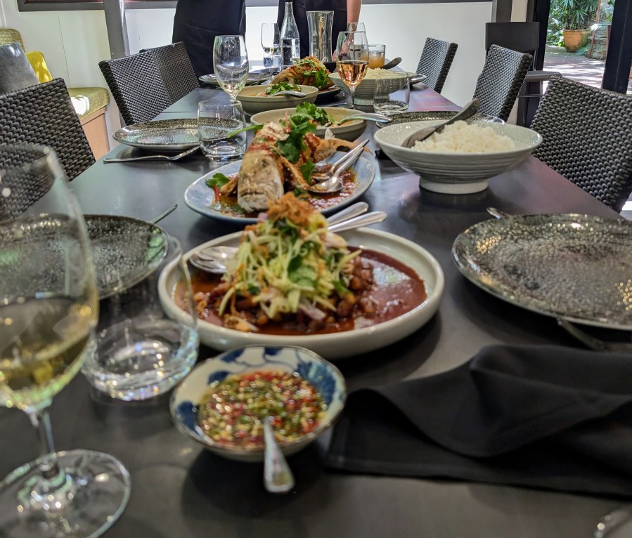 Food cooked at the cooking school at Spirit House Restaurant, not served. Wine in in glasses.